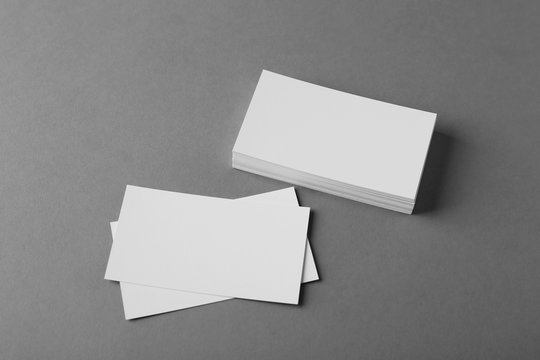 Blank business cards on grey background