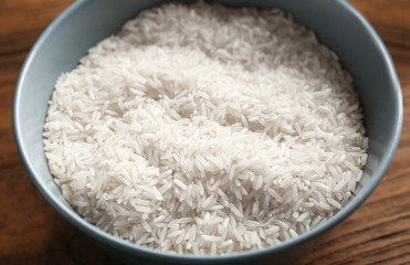 Bowl with rice on kitchen table, closeup