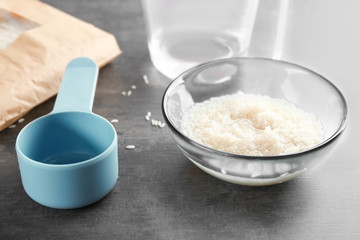 Glass bowl with rice on kitchen table