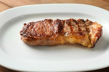 Plate with tasty steak, closeup