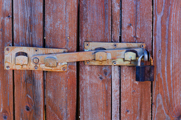 The old castle, the latch on a wooden fence