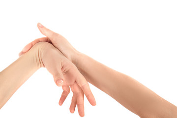 Hands of young woman suffering from pain in wrists on white background