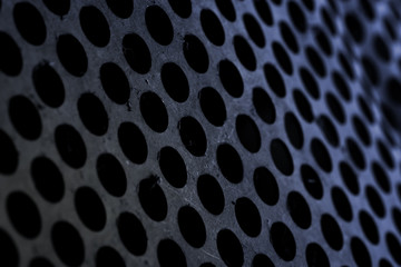 Pierced metal sheet, textured background