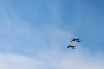 Naklejka na ściany i meble Military airplanes in the blue sky