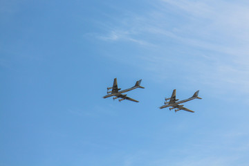 Fototapeta na wymiar Military airplanes in the blue sky