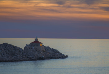 Fototapeta premium Lighthouse in sunset; island Grebeni, Dubrovnik, Croatia