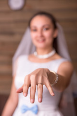 Bride showing golden wedding ring on her hand