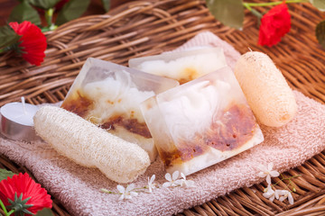 Natural spa beauty treatment products on tower in wicker basket