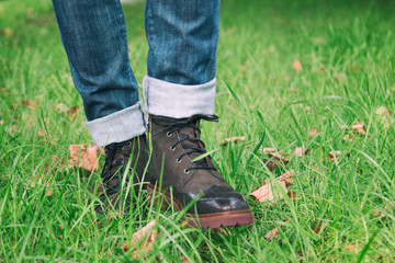 Woman walking on grass in shoes
