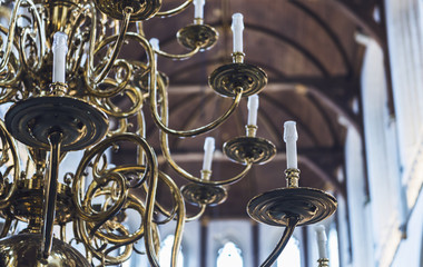 Fototapeta na wymiar Partial view of an elaborate brass chandelier
