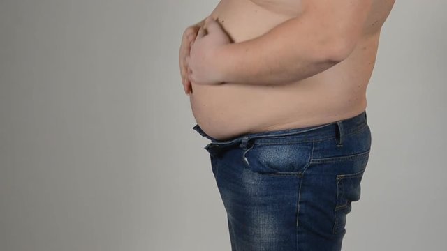 Obesity. Man and a big belly. 