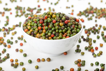fresh green and orange peppercorns
