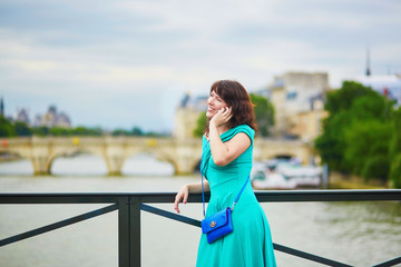 Young woman with mobile phone in Paris