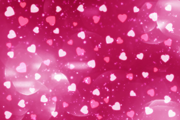 Pink abstract Valentines Day festive background and heart bokeh, glitter or circles lights with hearts. Round  defocused particles