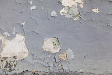 grey textured wall of old paint