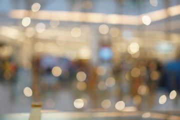 Bokeh lights in sepia tone background in department store shopping