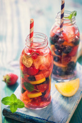 Infused water with fresh berry fruits,lemon, orange and Mint