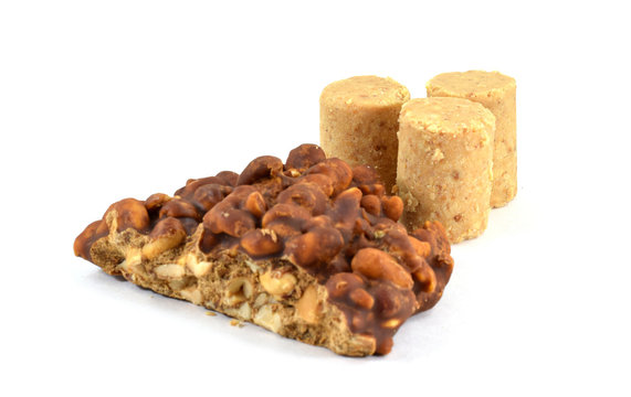 Brazilian "pe de moleque" (Portuguese for "boy's foot") peanut dessert typical for festa junina (June Festival) with pacoca (ground peanut candy)