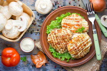 Veal Prince Orloff or French meat - veal chops with mushrooms tomatoes onion cheese and mayonnaise