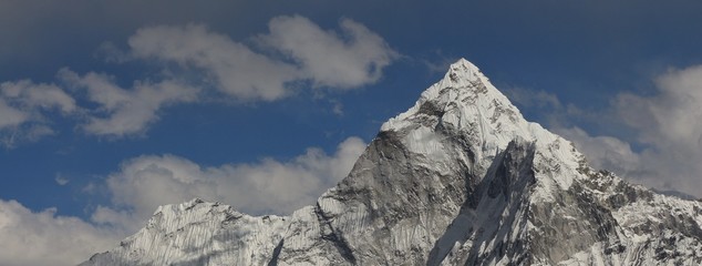 Peak of mount Ama Dablam on a cloudy spring day. View from Dzongla. Mount Everest National Park, Nepal.