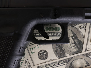 Moneys and gun concept.