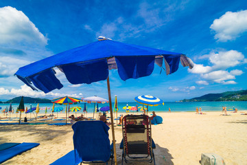 Beach chair summer on island vacation holiday relax in the sun with umbrella.
