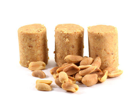 Pacoca, Brazilian peanut candy eaten during Festa Junina, "June Festival" with roasted peanuts - isolated