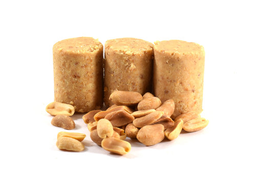 Pacoca, Brazilian peanut candy eaten during Festa Junina, "June Festival" with roasted peanuts - isolated