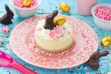 Easter cottage cheese dessert decorated with whipped cream and Easter bunny chocolate candy