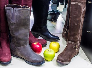 Women's boots in the shop in the shop window