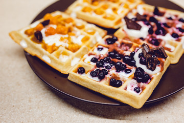 Wafers with chocolate, cloudberries, blueberries and ice cream. Needlework.