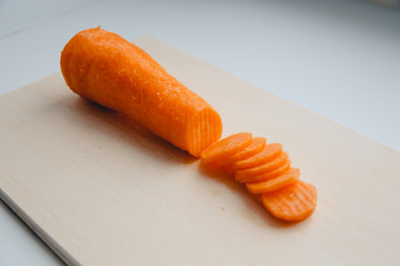 Sliced carrots with waves on a cutting board