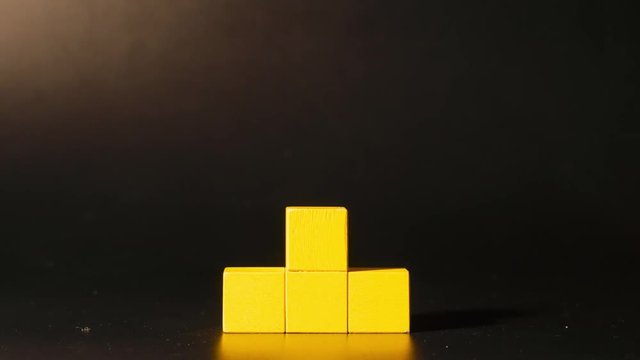 Man's hand picking 3D tetris
