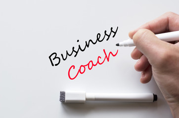 Business coach written on whiteboard