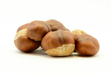 Closeup chestnuts isolated on white background. Fresh autumn chestnut. Sweet natural fruit the chestnut tree. Sign of autumn. Autumn decoration from chestnuts.