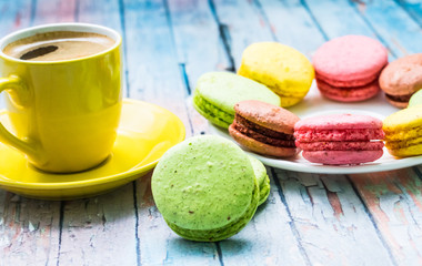 Still life with cup of tea and sweets on the wooden background
