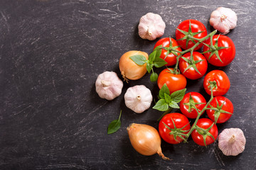 fresh vegetables for cooking on dark table,