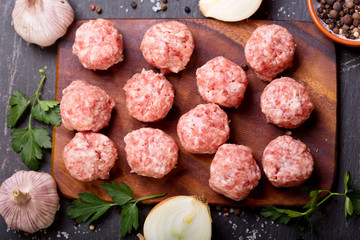 fresh raw meatballs with vegetables
