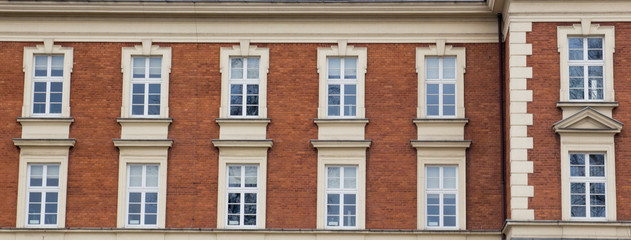 Fototapeta na wymiar Twelve vintage design windows on the facade of the old house.