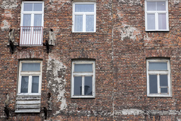 Window on the brick facade of an old house