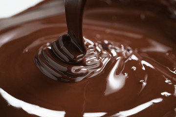 macro photo of premium dark chocolate pour in bowl