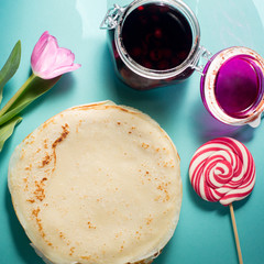 Russian pancakes with cherry jam for breakfast