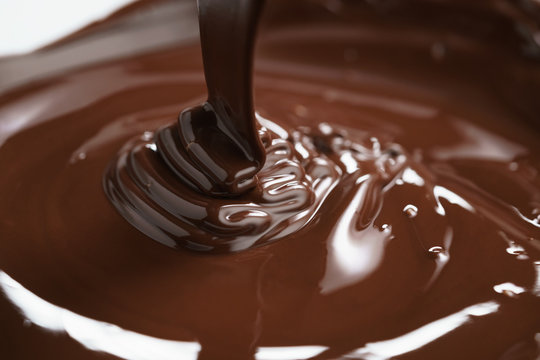 Macro Photo Of Premium Dark Chocolate Pour In Bowl