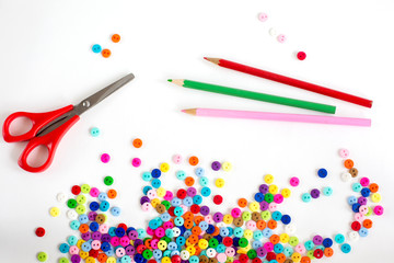 Needlework, spring mood, colored buttons and pencils