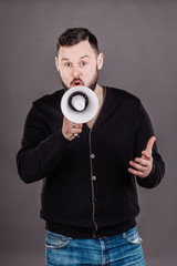 man holding megaphone. human emotion expression and lifestyle concept.