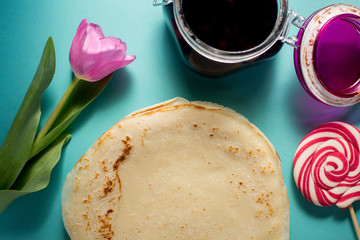 Russian pancakes with cherry jam for breakfast