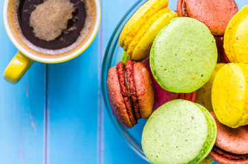 Still life with cup of tea and sweets on the wooden background
