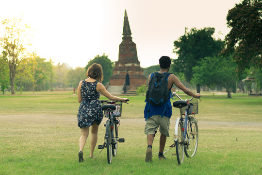 Tourist is traveling at Ayutthaya with bicycle.