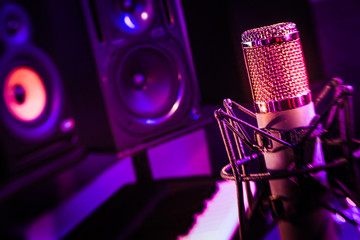 LensBaby tilt shift background, recording studio vintage microphone.
