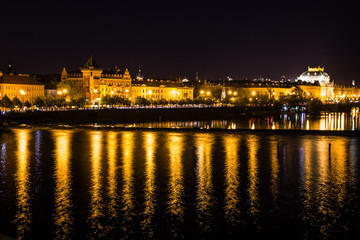Prague architecture and Vltava river night view, Czech Republic.